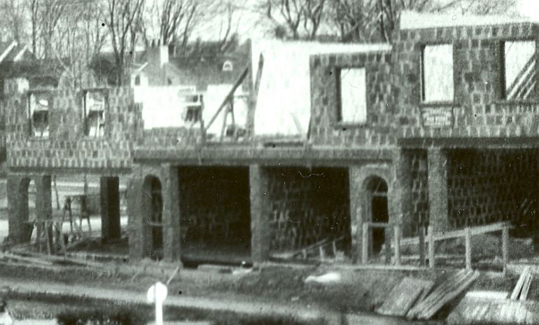 The two story Tudor Building adjacent to the Long Island Rail Road Station under construction c. 1925 in Kew Gardens, NY.