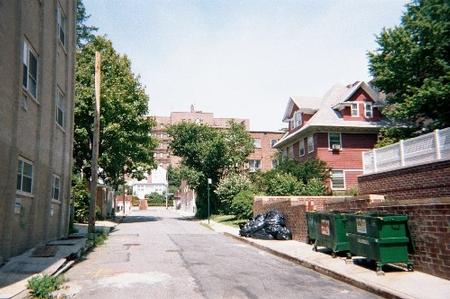 Looking north on 117th Street from 84th Avenue, Kew Gardens, NY.  Sadly, the red house on the right was demolished in July of 2003.